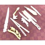Tray of assorted carved bone items