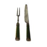 A pair of green-stained bone handled knife and fork,