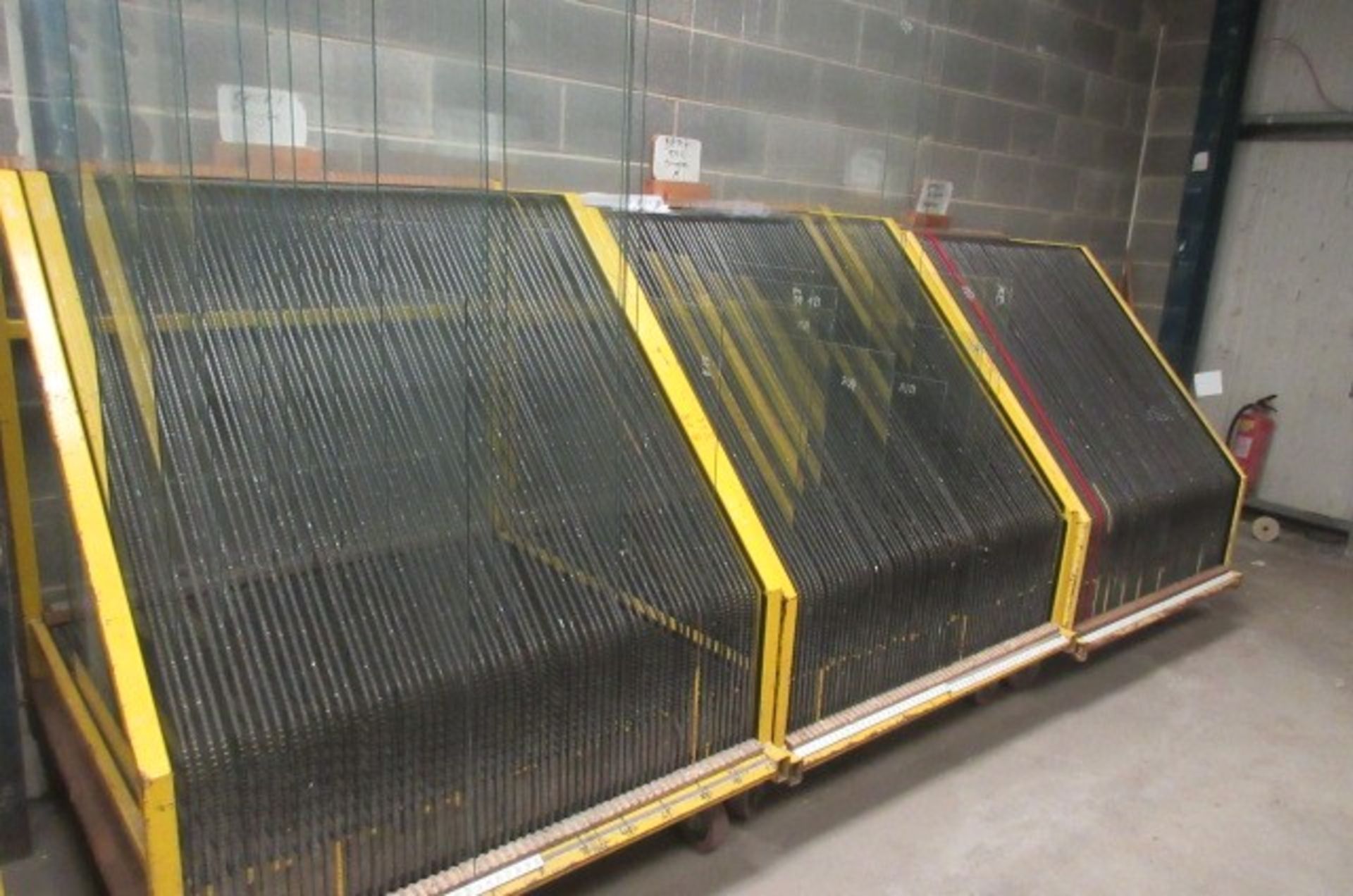 Four mobile 60 space glass transportation racks. Size 1300 x 1300 x 1500mm high.