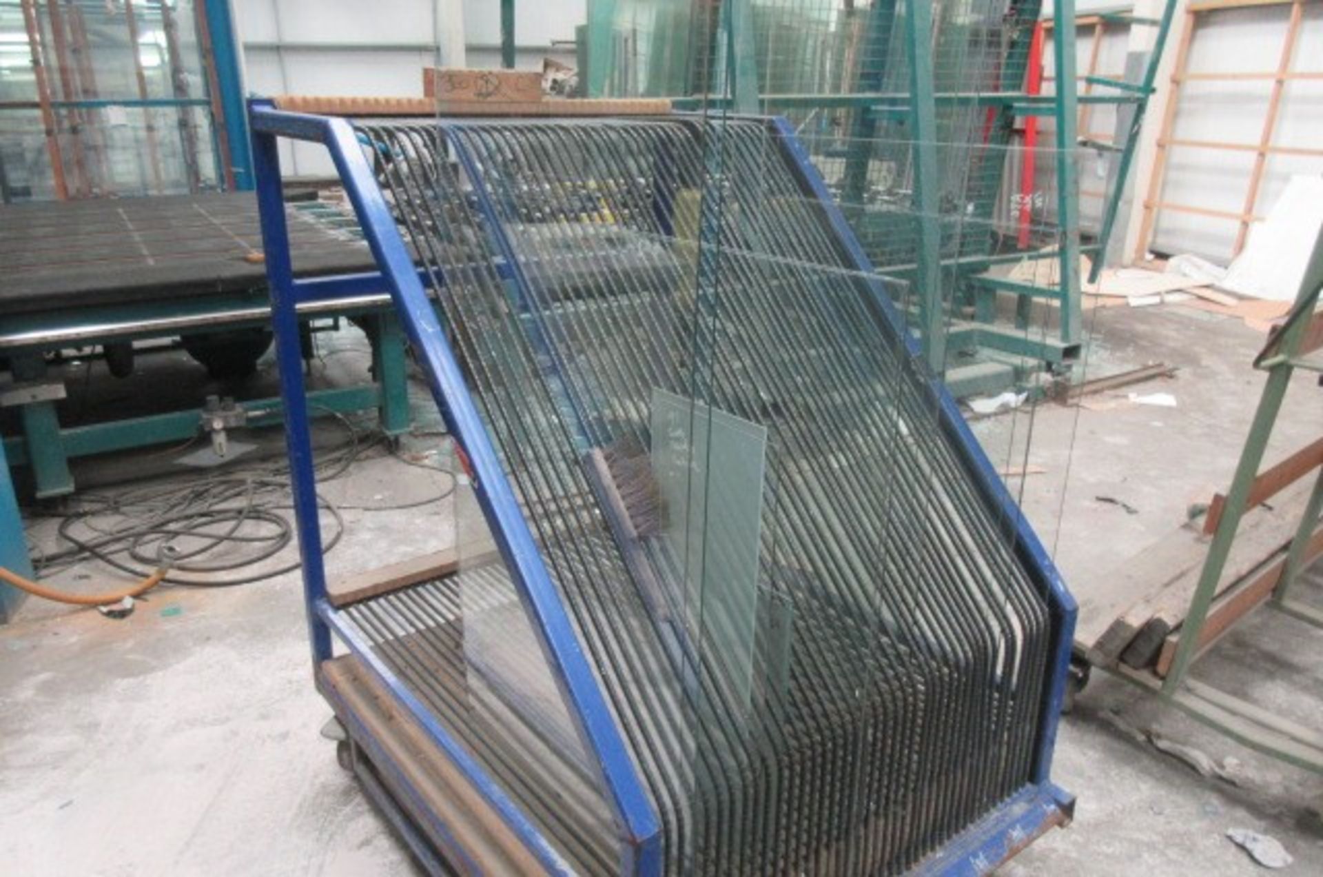 Four mobile 60 space glass transportation racks. Size 1300 x 1300 x 1500mm high.
