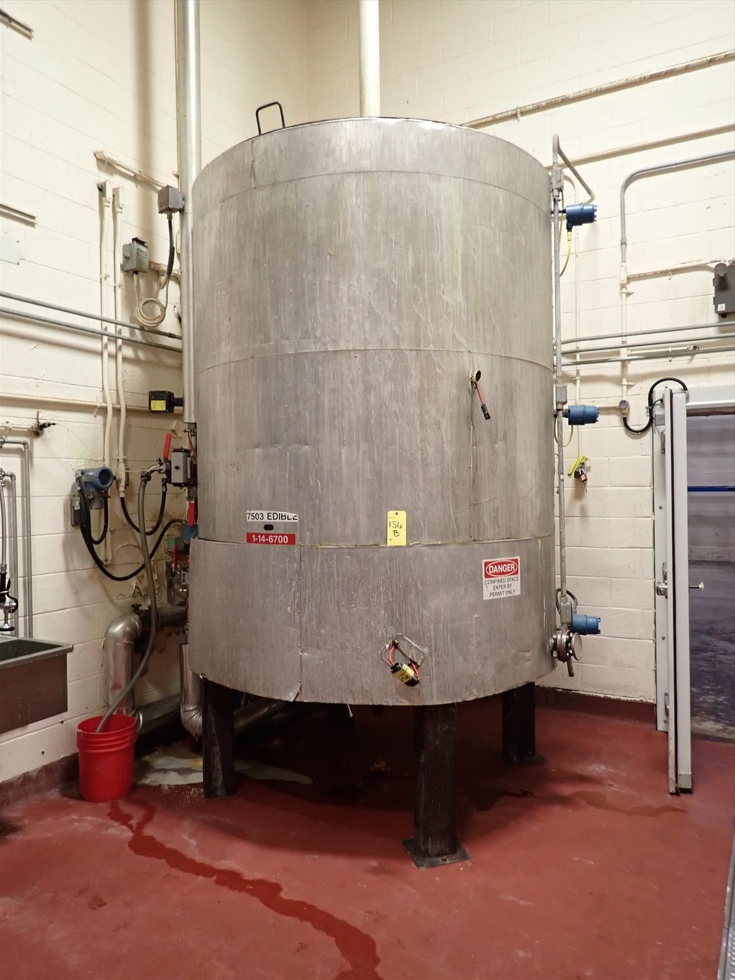 tank, approx. 99" x 84" dia., bottom discharge w/ agitator c/w Ttuthill pump and Micromotion mass