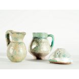 Set of three glazed ceramic Arab jugs