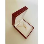 9ct yellow gold pearl necklace with diamond bale on a 9ct yellow gold chain. D 0.07ct. Boxed