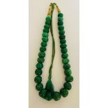 In excess of 1000ct earth mined green emerald carved bead necklace