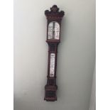 A large victorian carved architectural mercurial barometer