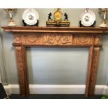 An antique Georgian fireplace carved in pine.