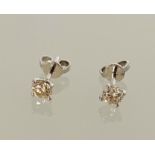 Pair 18ct white gold four claw round brilliant cut diamonds studs. 0.84ct. Boxed