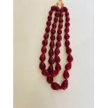 In excess of 1200ct, earth mined red ruby 2 line pear shape carved beads necklace