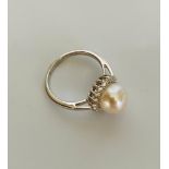 9ct white gold pearl and diamond halo ring. D 0.37ct