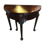 An Extremely fine Irish George II Mahogany folding tea table.