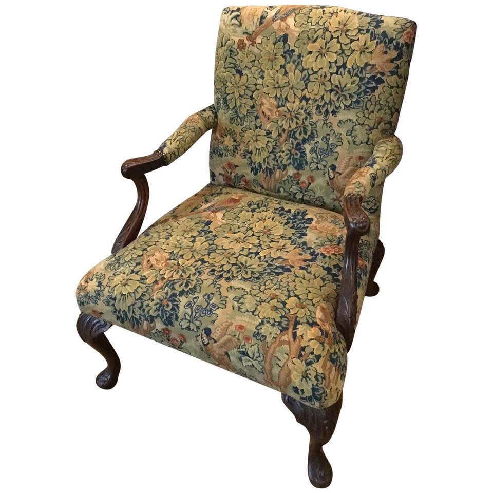 A Victorian George III style mahogany framed 'Gainsborough' armchair. ?This 'Gainsborough' style