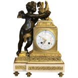 Empire style mantel (fireplace) clock with white marble base. Classical gilt bronze detail to clock