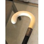 A Gentlemans ebonised and ivory walking stick. Circa 1880. With gilt metal collar. 80cm long