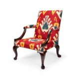 A George II mahogany library open armchair in the manner of Giles Grendey