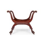 A late 19th century mahogany carved 'X' frame 'curule' window seat