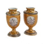 A pair of small 19th century French porcelain vases with silver gilt mounts
