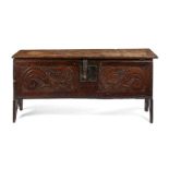 A mid 17th century oak carved chest
