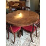 A William IV Irish yew, rosewood banded and sycamore marquetry centre table