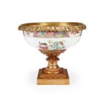 A Chinese Qianlong period famille rose gilt bronze mounted bowl on a footed base