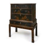 A William & Mary black japanned chest on later stand