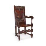A Queen Anne oak panel-back open armchair, North Country