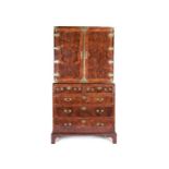 A George I burr walnut, featherbanded and crossbanded cabinet on chest