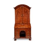 A George II walnut crossbanded and featherbanded kneehole bureau cabinet