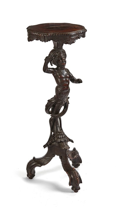 A late 19th century Italian walnut figural tripod candlestand