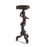 A late 19th century Italian walnut figural tripod candlestand