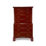 A George III walnut chest on chest