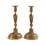 A pair of Louis XVI ormolu candlesticks