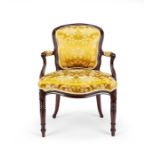 A George III carved mahogany armchair