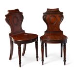 A pair of Regency mahogany hall chairs attributed to Banting & France & Co.