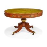 A Regency satinwood and tulipwood crossbanded drum top table