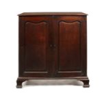 A George II carved mahogany low linen press in the manner of Giles Grendey