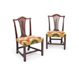 A pair of George III carved mahogany dining chairs