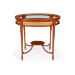 An Edwardian satinwood painted oval bijouterie table or vitrine