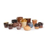 A group of twelve 19th century and later earthenware storage pots
