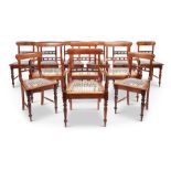A set of twelve South African stinkwood dining chairs by Jonker Brothers of Knysna