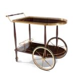 A 1950's mahogany and brass two-tier cocktail trolley