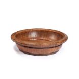 A large 19th century elm and pine shallow dairy bowl