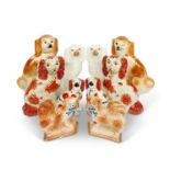 A group of five pairs of Staffordshire spaniel dogs
