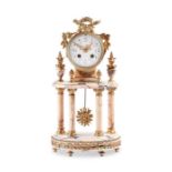 A late 19th / early 20th century French Louis XVI style marble mantel portico clock