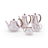 A modern designer silver five-piece matching tea and coffee set designed by Eric Clements