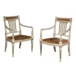 A pair of George III white and green painted open armchairs