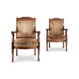 A pair of Empire mahogany caved fauteuils