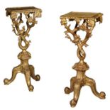 A pair of George III style carved gilt wood tables / torchere stands