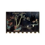 A late 19th century Chinese black and polychrome coromandel lacquer eight-fold screen