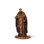 An 18th century polychrome and parcel gilt figure of a saint, probably St Anthony