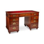 A late Victorian mahogany campaign pedestal desk